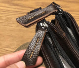 Close-up of brown leather handbag zipper and textured leather pull tab