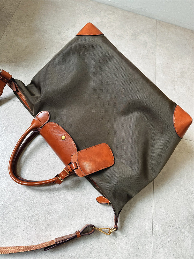 Recycled nylon cowhide tote flat lay – showing nylon body and cowhide leather corner detail