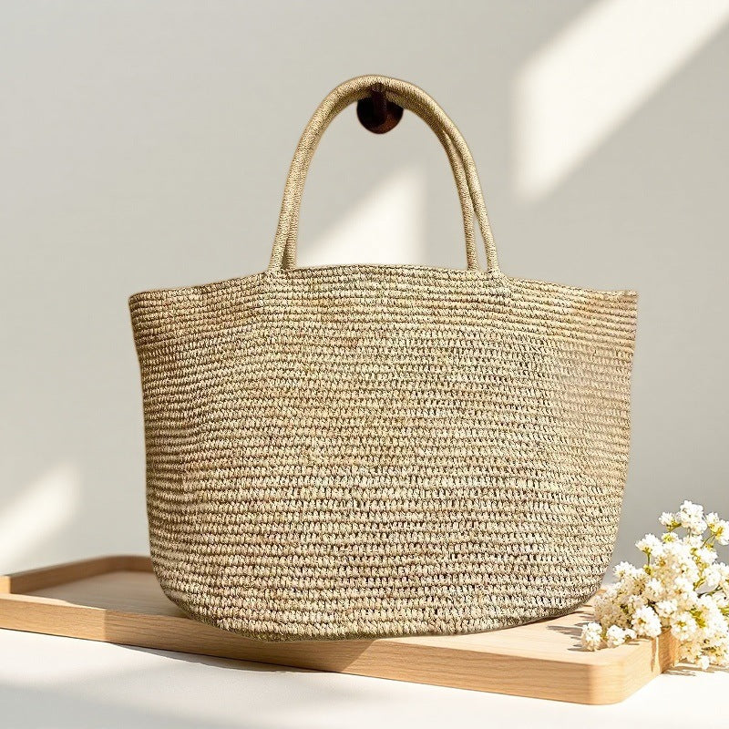Handwoven raffia beach tote interior – structured woven straw bag with reinforced handles