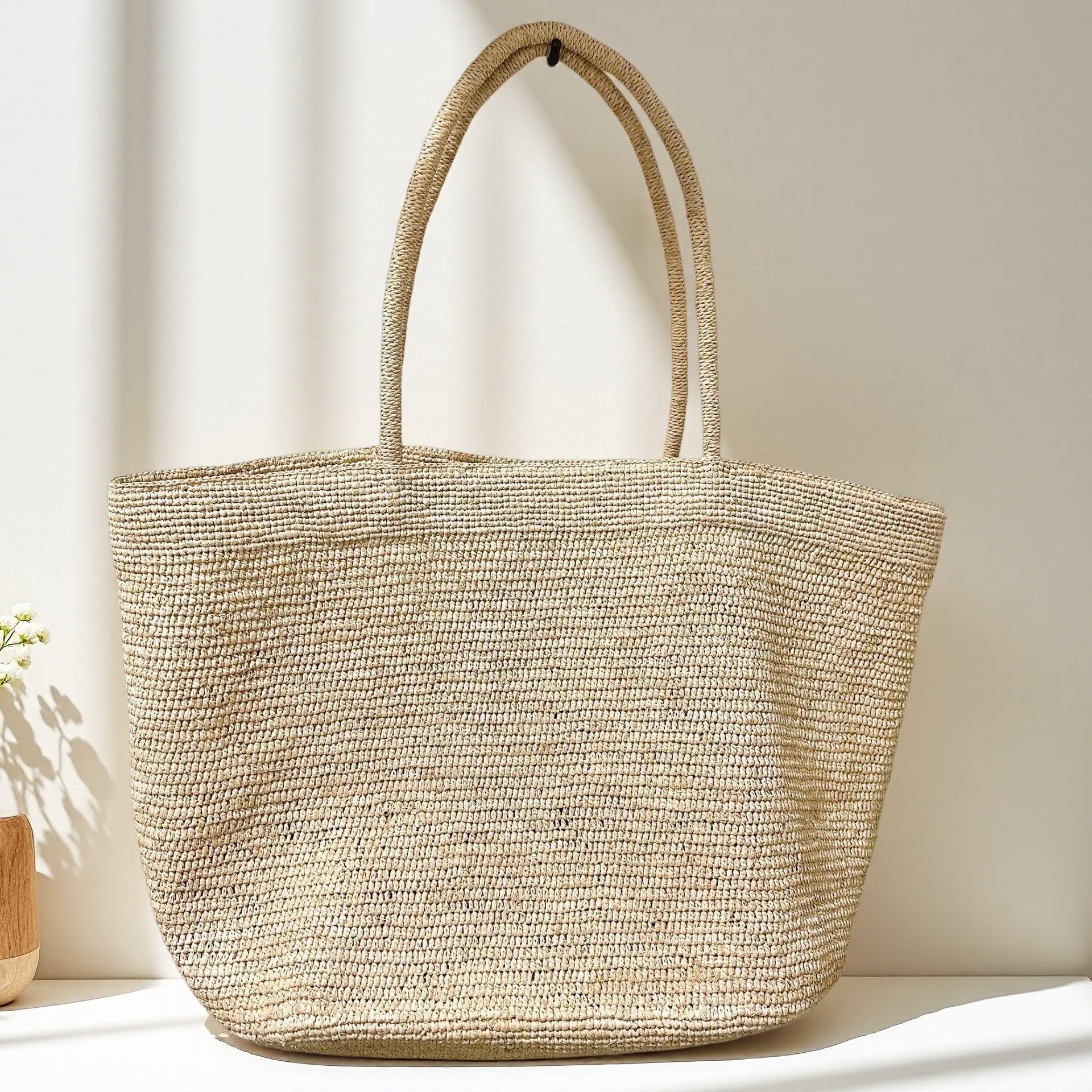 Handwoven raffia tote bag size comparison – standard and large natural straw vacation bag