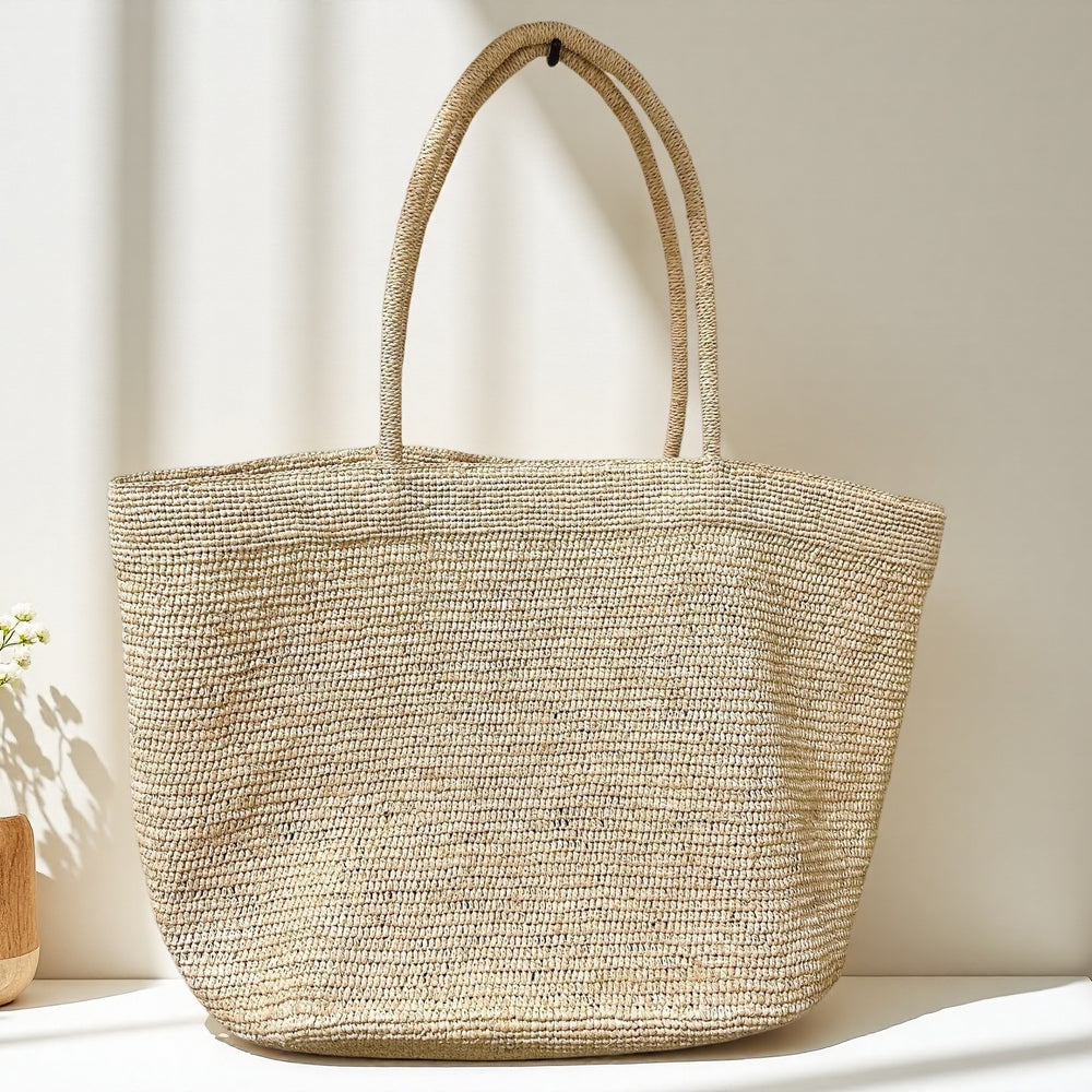Handwoven raffia tote bag size comparison – standard and large natural straw vacation bag