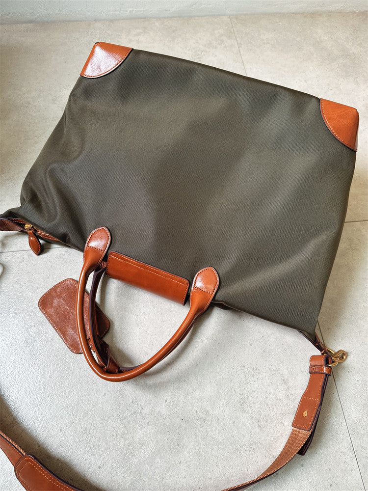Recycled nylon cowhide tote open showing organised interior – laptop slip and zip pocket