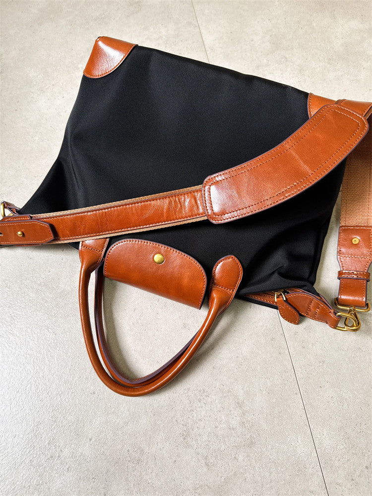 Handmade nylon cowhide tote bag on desk – open showing laptop and documents inside