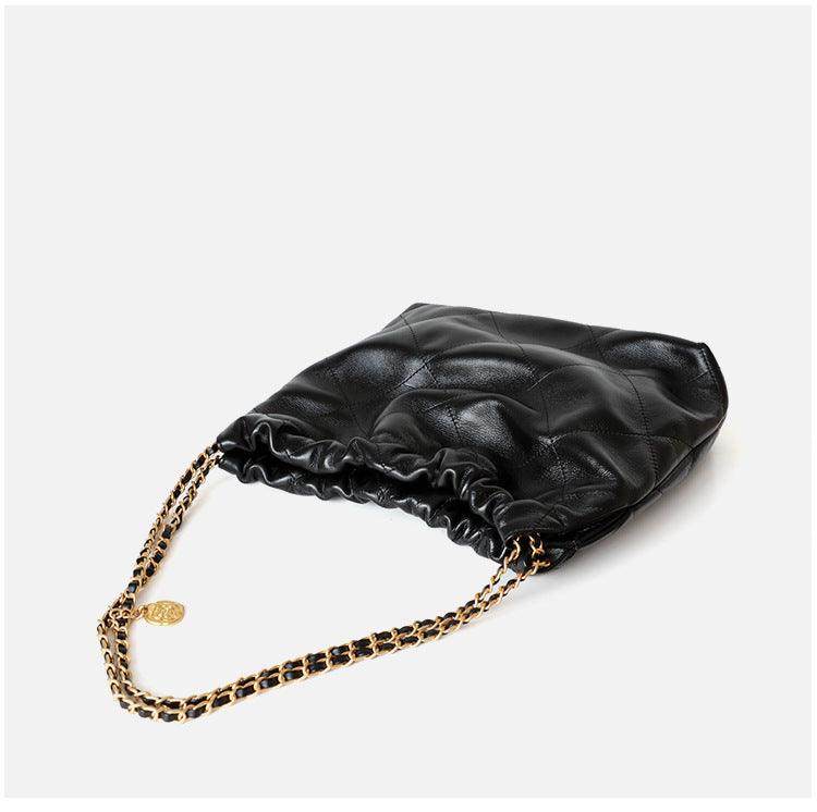 Large black quilted calfskin leather shoulder bag with gold-tone chain strap on white background