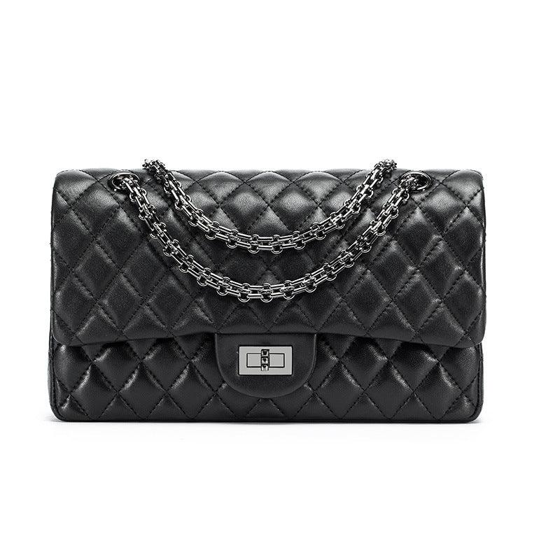 Quilted black genuine leather crossbody shoulder bag with silver chain strap and turn-lock clasp
