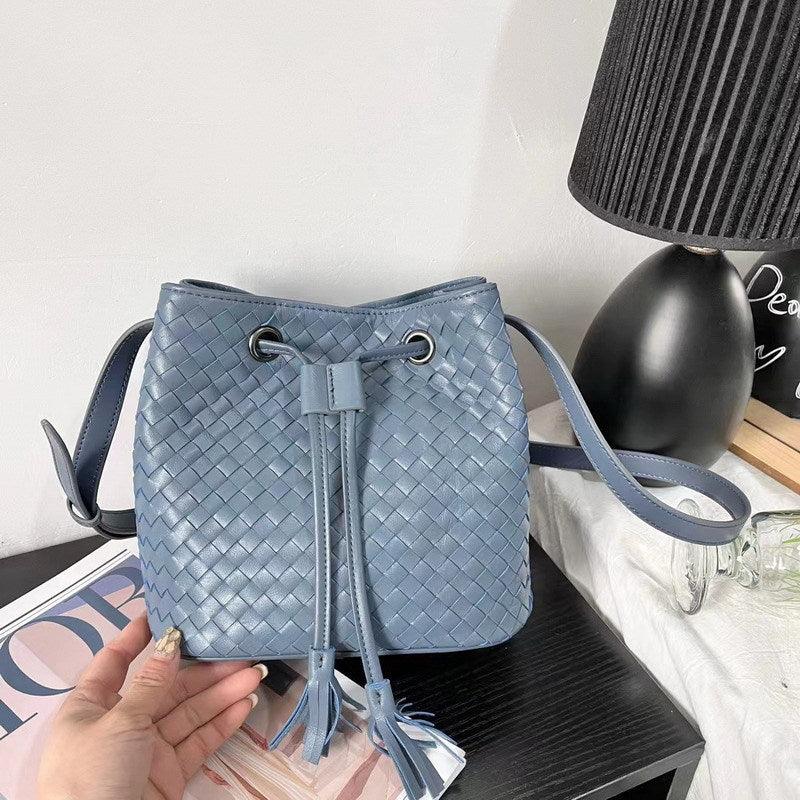 Blue woven lambskin leather bucket bag with drawstring and tassels, medium shoulder purse