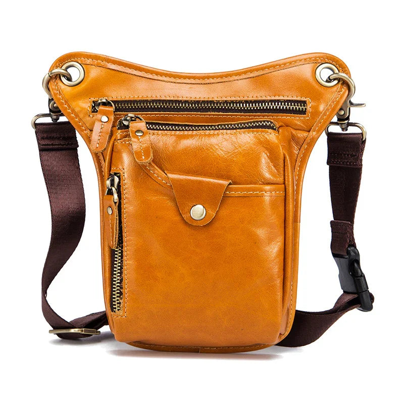 Full grain leather leg bag with brown straps, multiple zip pockets, and gold hardware.