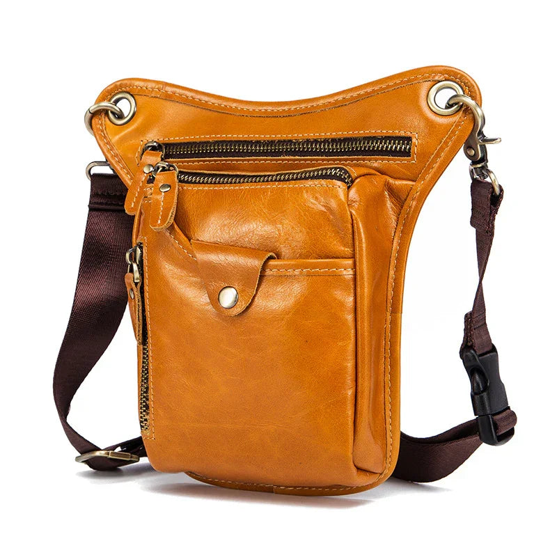 Full grain leather leg bag with multiple zip pockets and adjustable brown strap