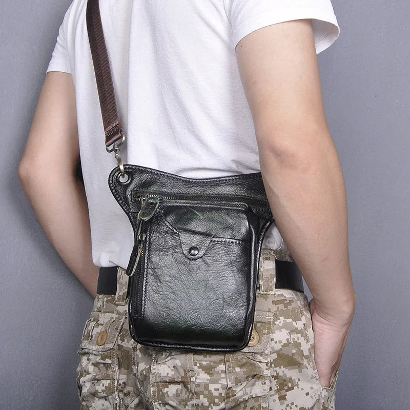 Full grain leather leg bag for men, black, with zip and snap pockets, worn crossbody