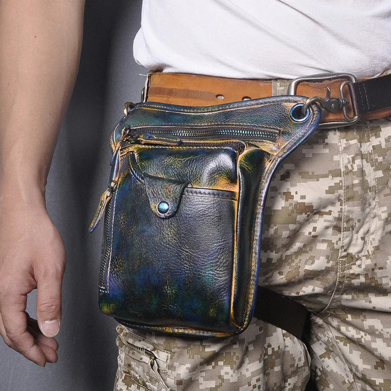 Full grain leather leg bag with multi-zip pockets worn on waist, camouflage pants visible