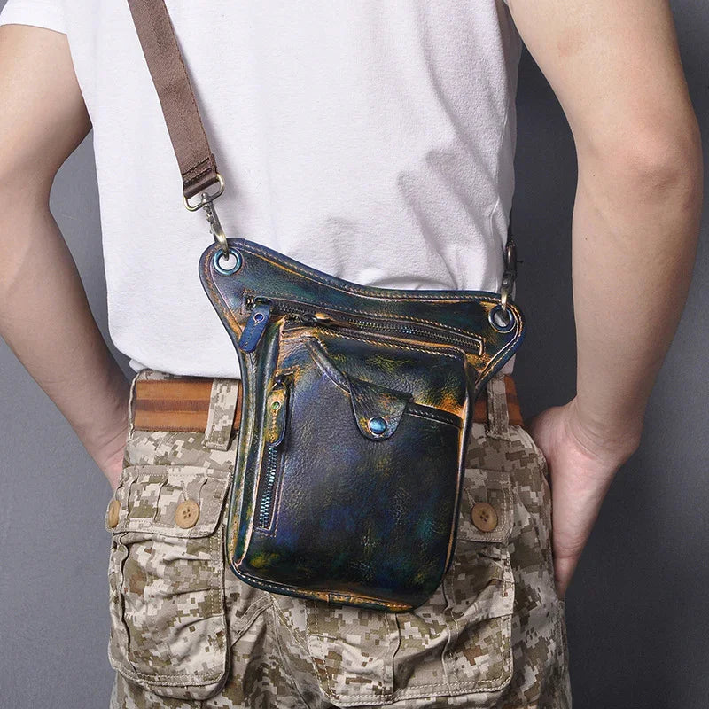 Full grain leather leg bag with multi-zip pockets worn on waist, camouflage pants visible