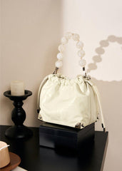 Grace Resin Handle Crossbody Beaded Bucket Bag | Leather Clutch with Floral Pleats