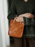 Handcrafted brown cowhide leather shoulder bag with stitched diamond pattern