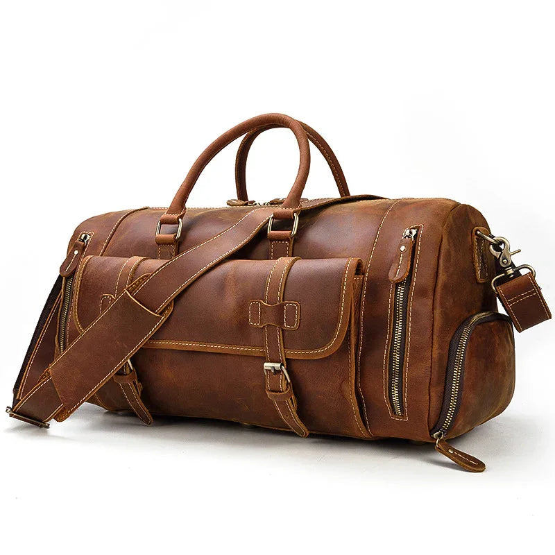 Handmade full grain leather duffle bag with front pocket, shoulder strap, and shoe compartment