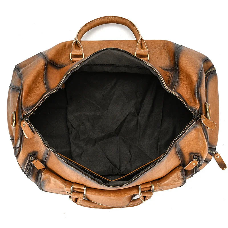 Open handmade full grain leather duffle bag with spacious interior and top handles