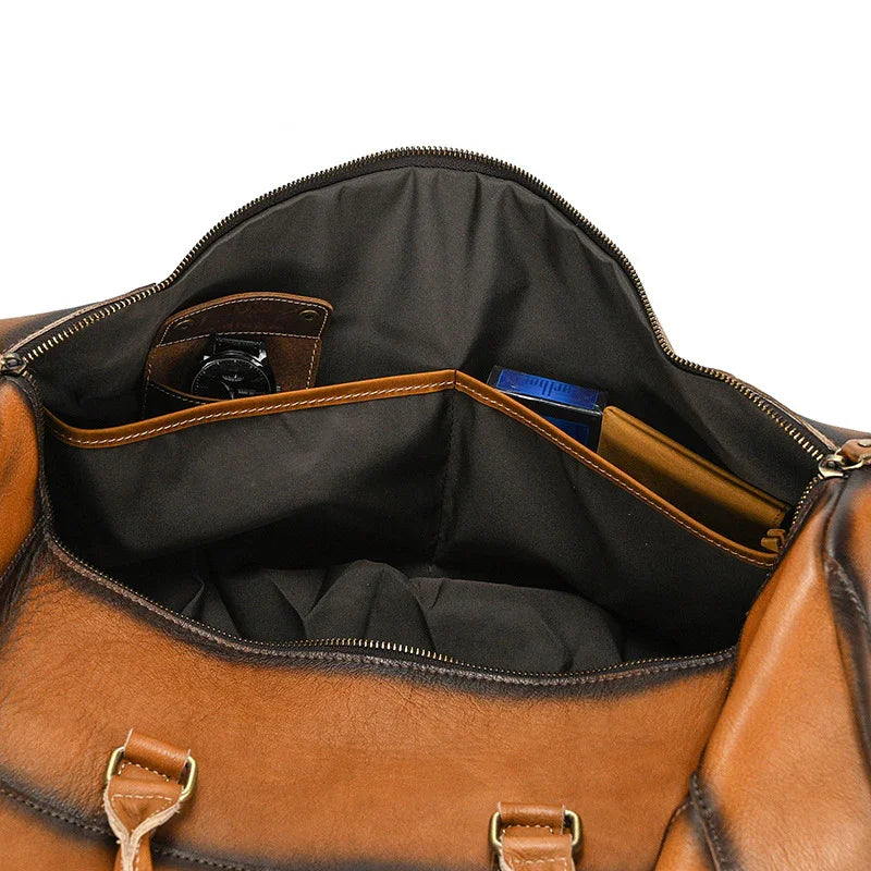 Interior view of handmade brown full grain leather duffle bag with multiple compartments