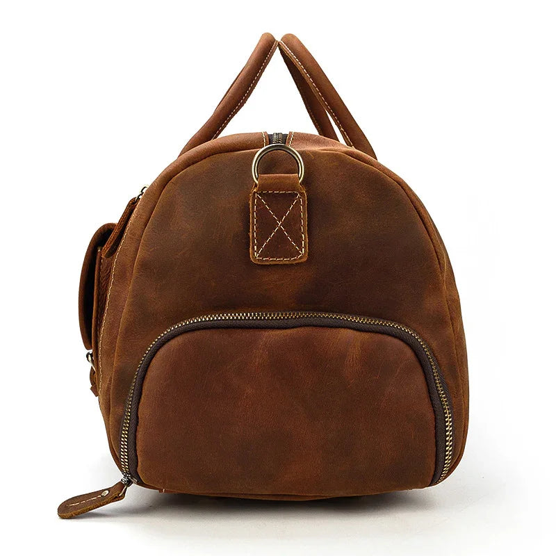 Handmade dark brown full grain leather duffle bag with zippered front pocket and top handles