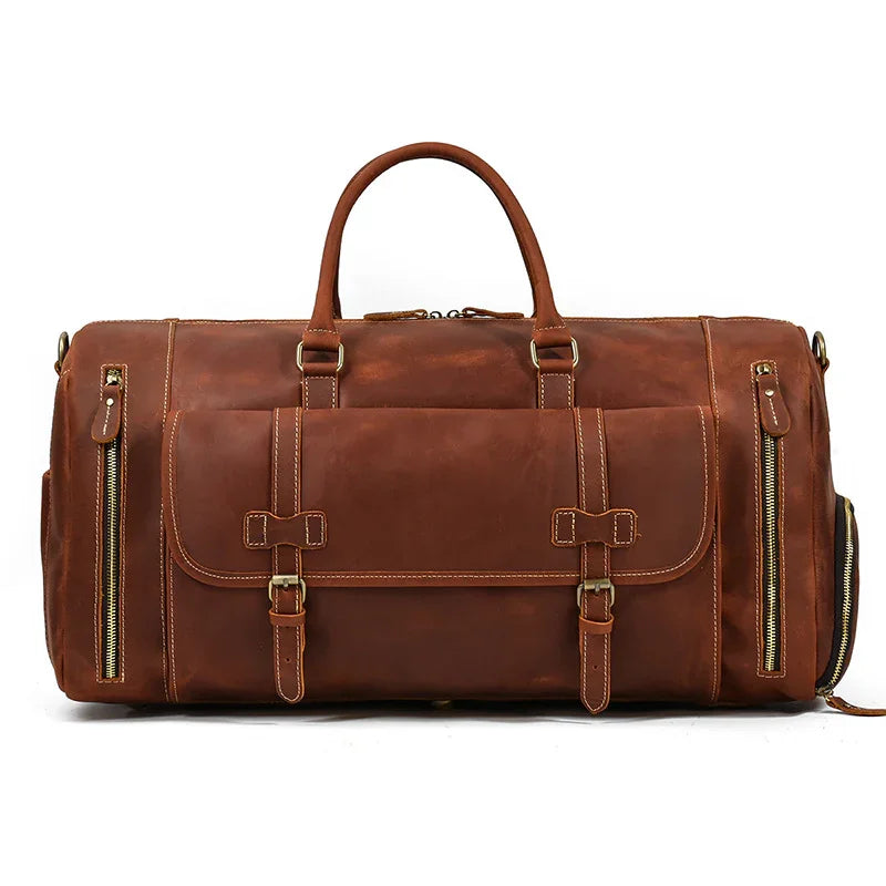 Handmade full grain leather duffle bag with shoe compartment and front buckles, dark brown.