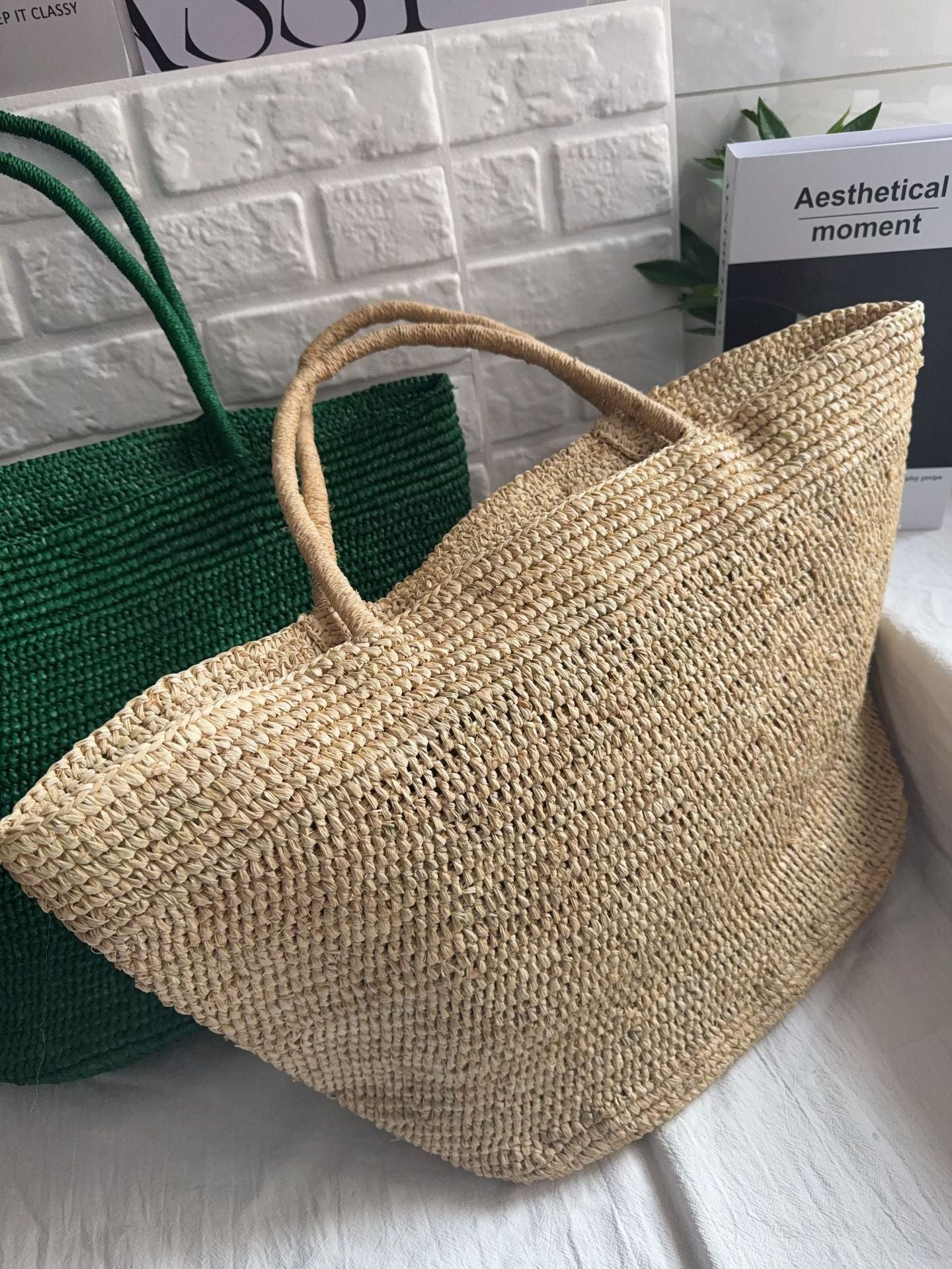 Raffia straw tote bag handle detail – reinforced woven handle on natural handmade beach tote