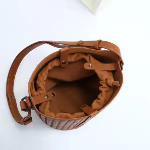 Brown woven lambskin leather bucket bag with shoulder strap, open top view