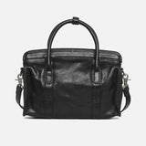 Black leather Boston bag with top handles and detachable shoulder strap on white background