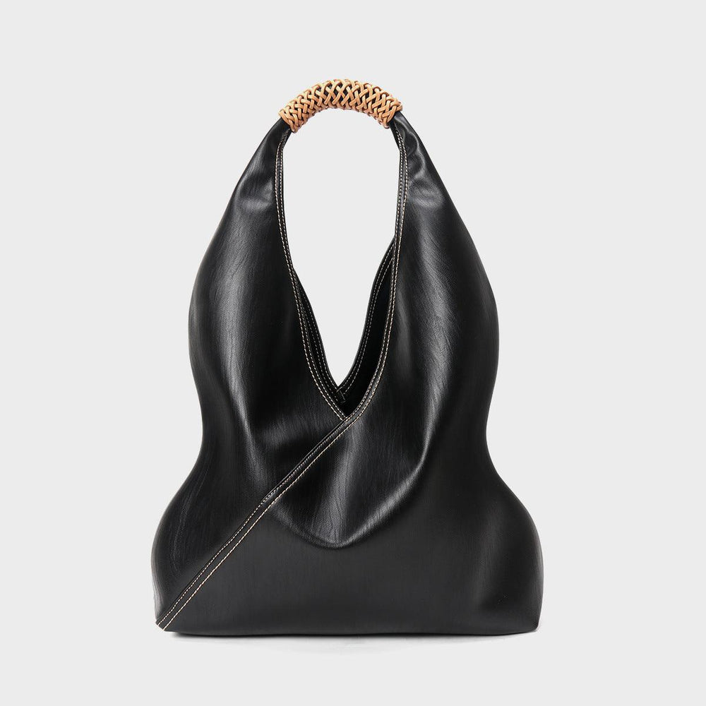 Minimalist black genuine leather bucket bag with woven handle, fashion tote for women