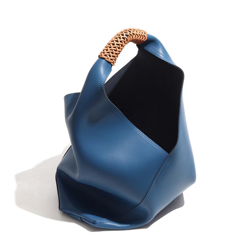 Minimalist blue leather bucket bag with woven handle, fashion tote for women