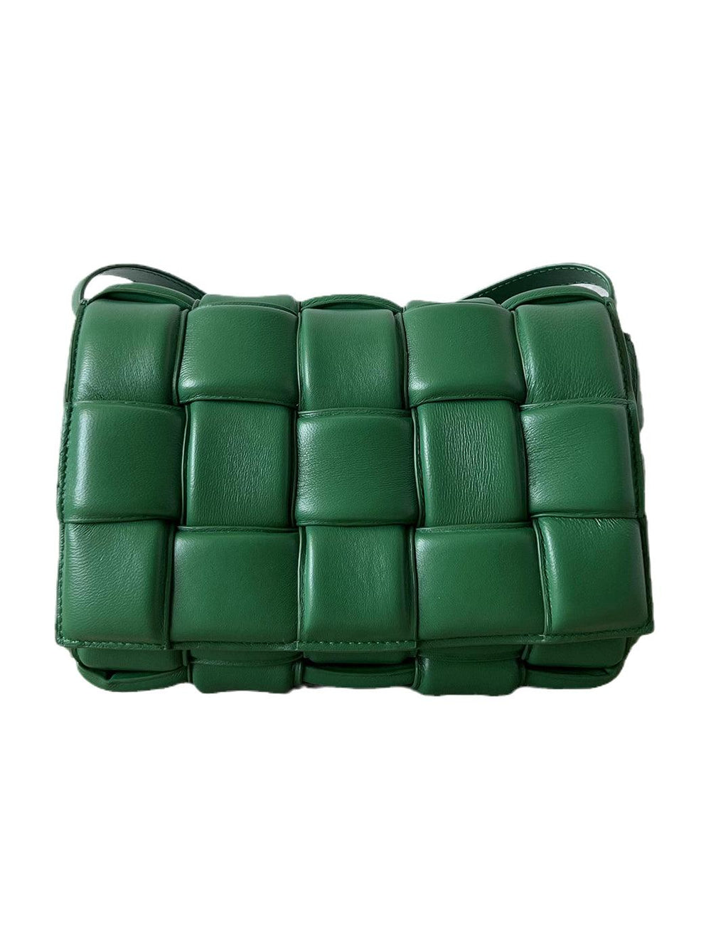 Green woven leather crossbody bag with padded squares, contemporary design