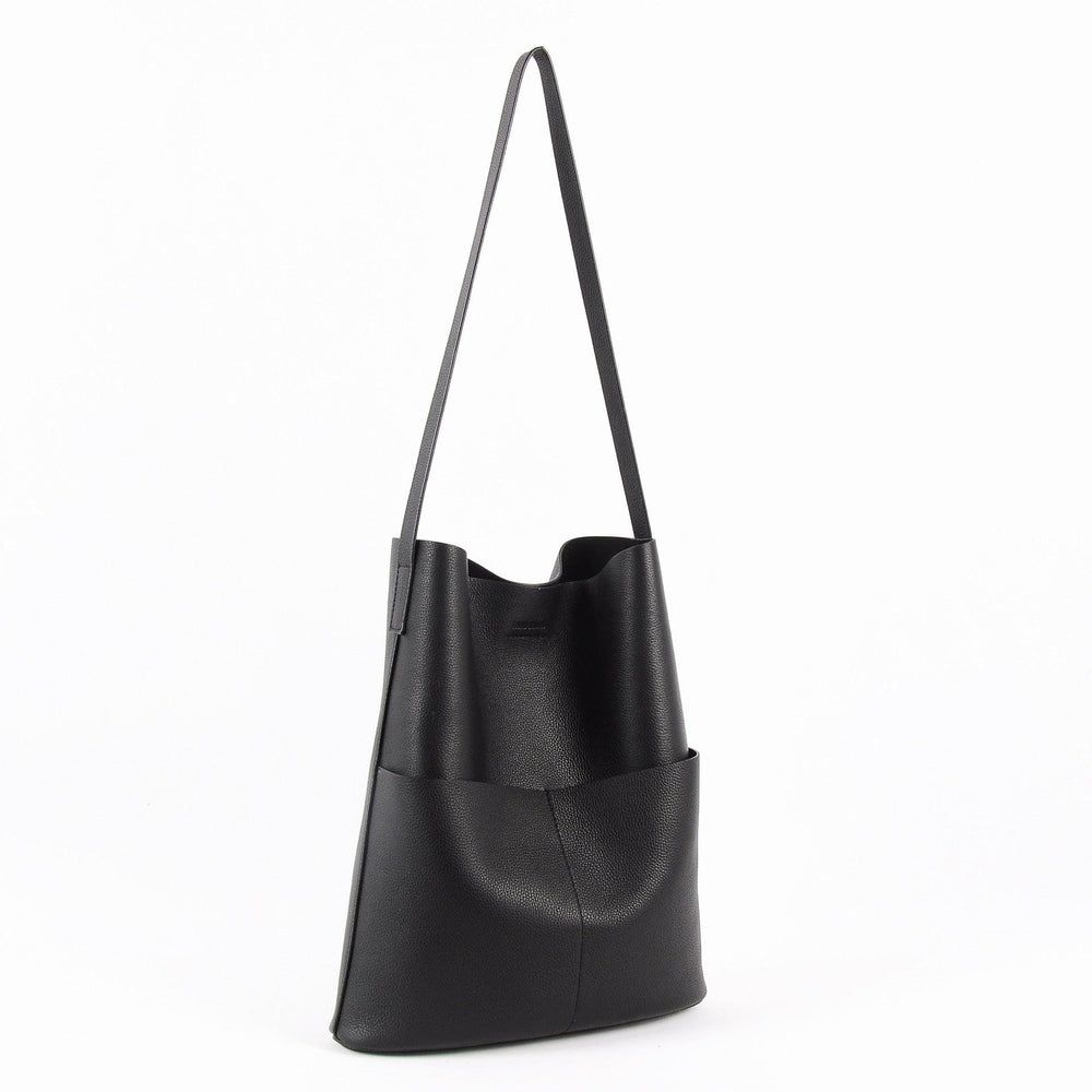 Black cowhide leather tote bag with two front pockets and long shoulder strap