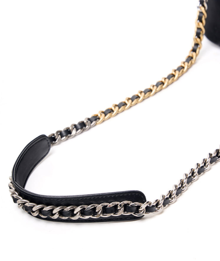 Leather shoulder bag strap with gold and silver chain on white background