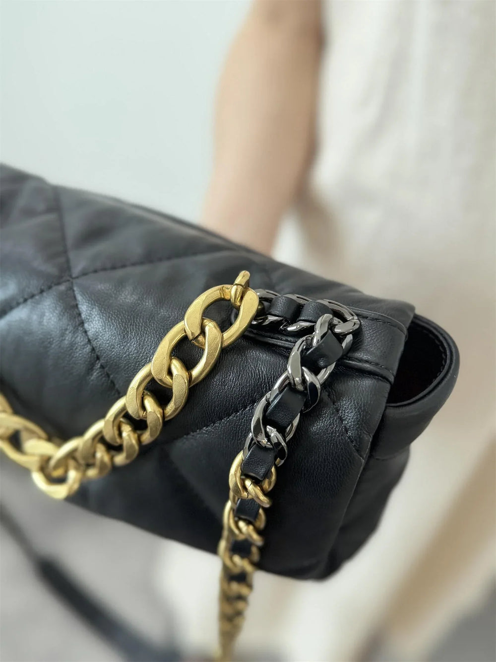 Black quilted genuine leather shoulder bag with gold and black chain strap