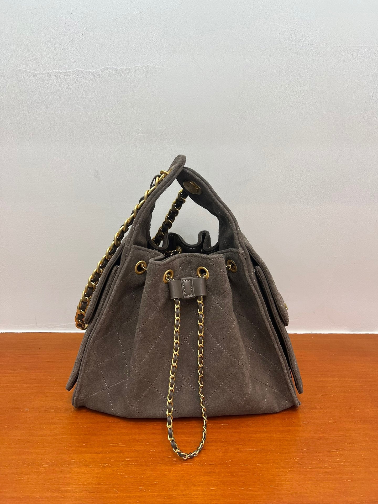 Quilted Suede Lambskin Drawstring Bucket Bag – Gold Chain Shoulder Bag | Diamond Quilt with Side Flap Pockets & Turn-Lock Clasp