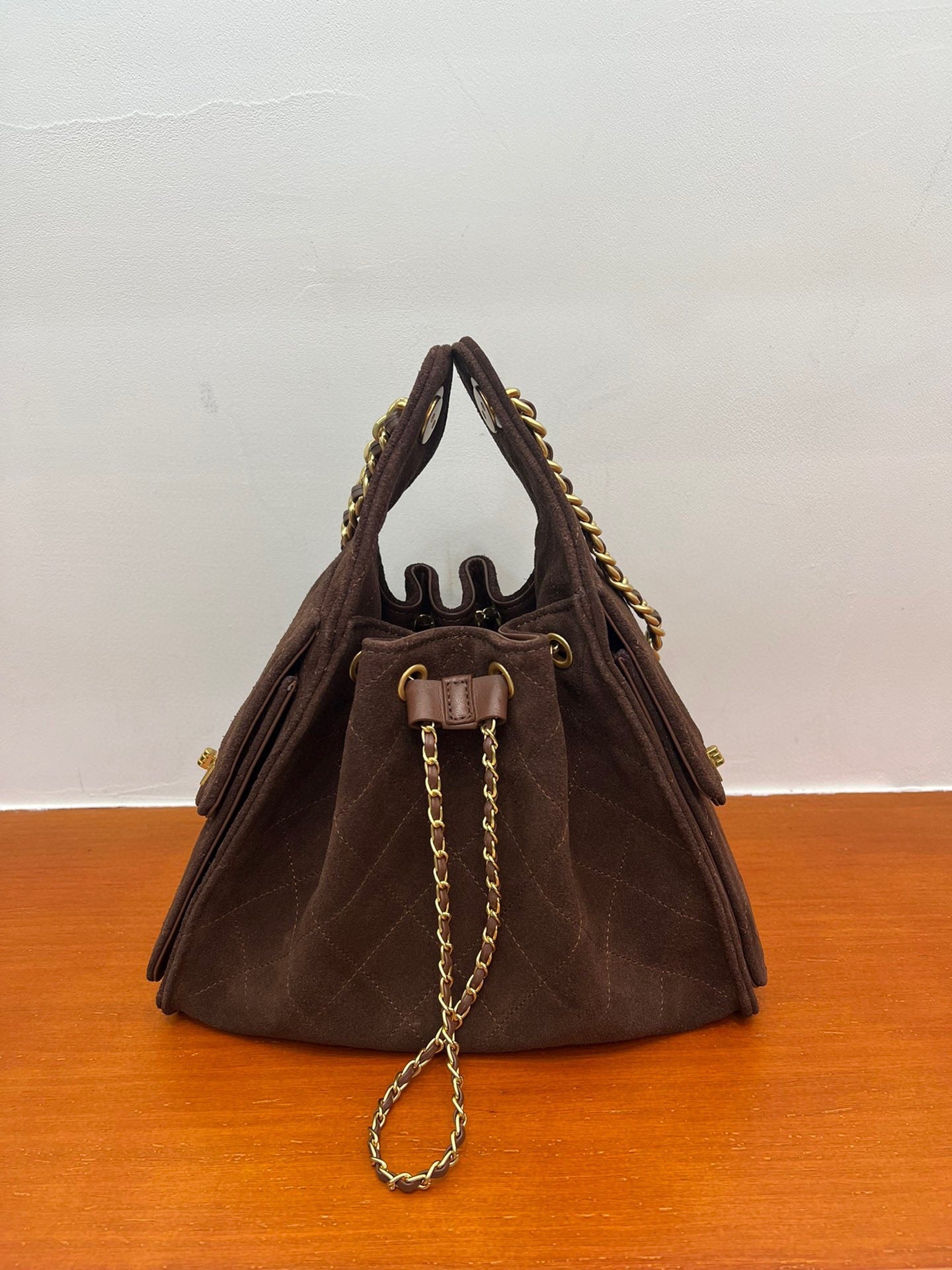 Quilted Suede Lambskin Drawstring Bucket Bag – Gold Chain Shoulder Bag | Diamond Quilt with Side Flap Pockets & Turn-Lock Clasp