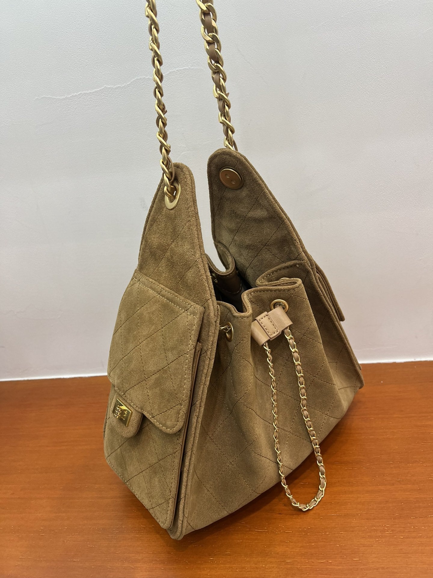 Quilted Suede Lambskin Drawstring Bucket Bag – Gold Chain Shoulder Bag | Diamond Quilt with Side Flap Pockets & Turn-Lock Clasp