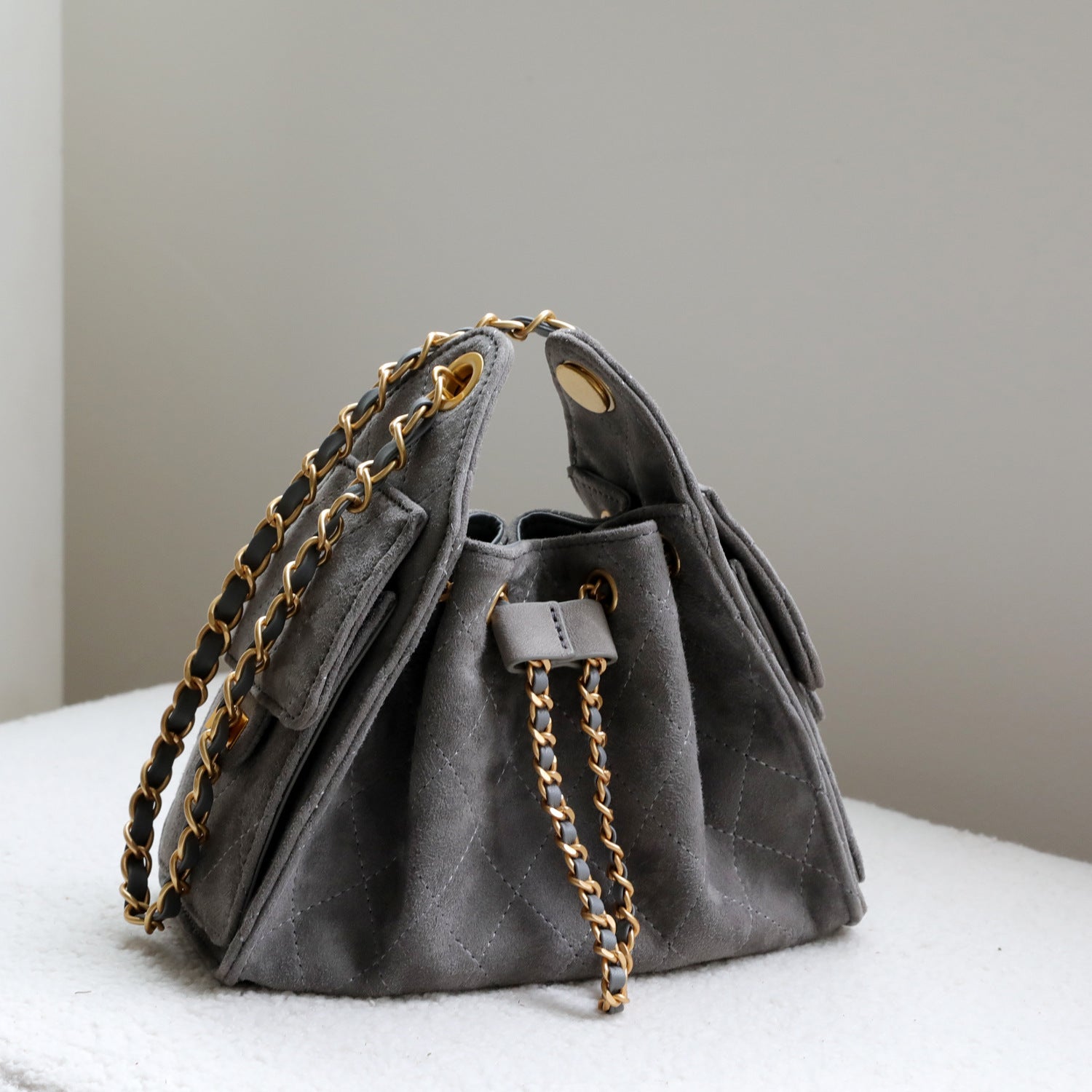 Quilted Suede Lambskin Drawstring Bucket Bag – Gold Chain Shoulder Bag | Diamond Quilt with Side Flap Pockets & Turn-Lock Clasp
