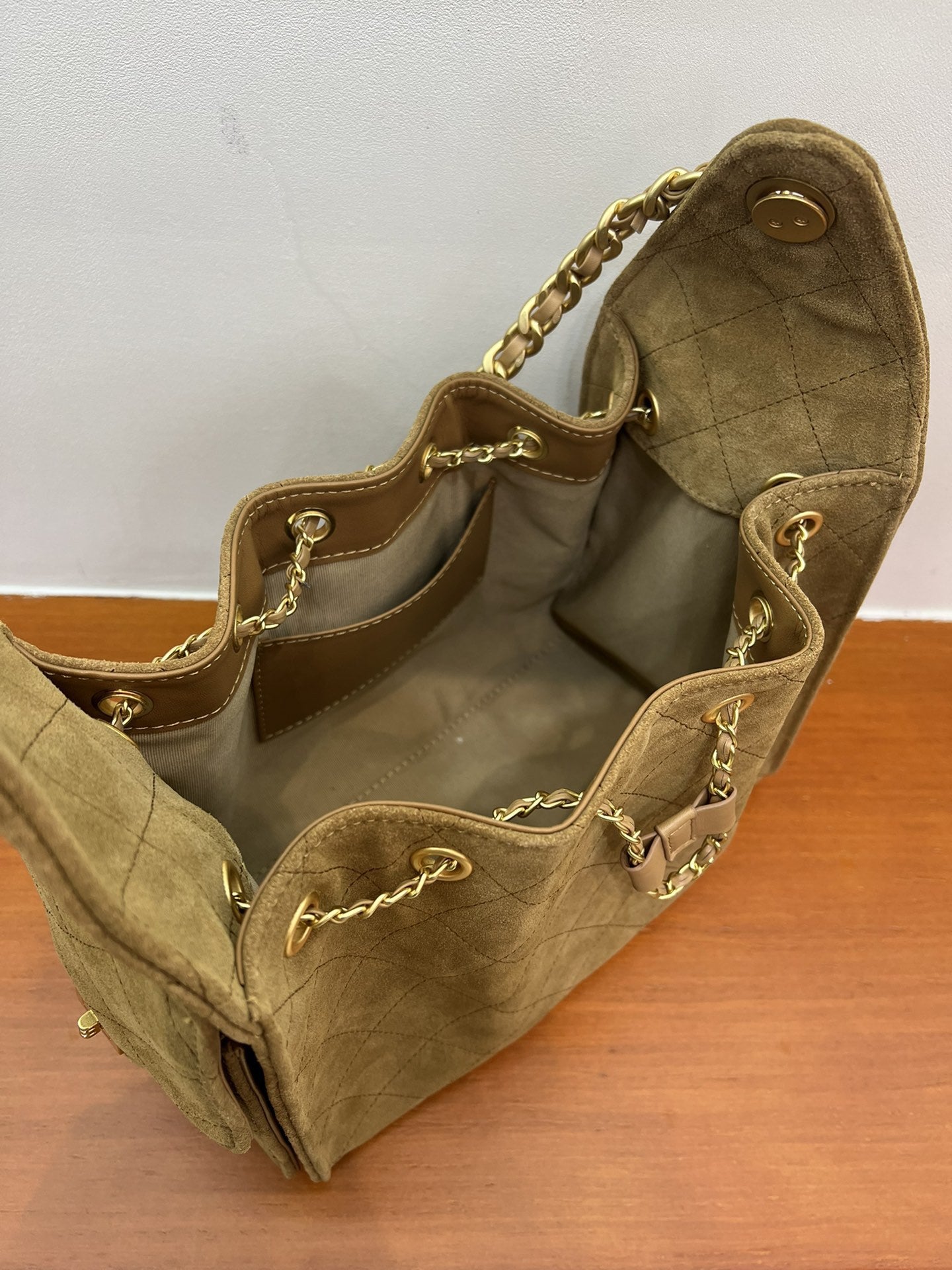 Quilted Suede Lambskin Drawstring Bucket Bag – Gold Chain Shoulder Bag | Diamond Quilt with Side Flap Pockets & Turn-Lock Clasp
