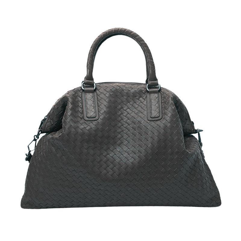 Large woven leather duffle bag with double handles in dark brown, on white background.