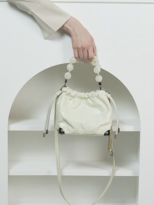 Grace Resin Handle Crossbody Beaded Bucket Bag | Leather Clutch with Floral Pleats