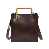 Dark brown genuine cowhide leather handbag with gold handles and shoulder strap