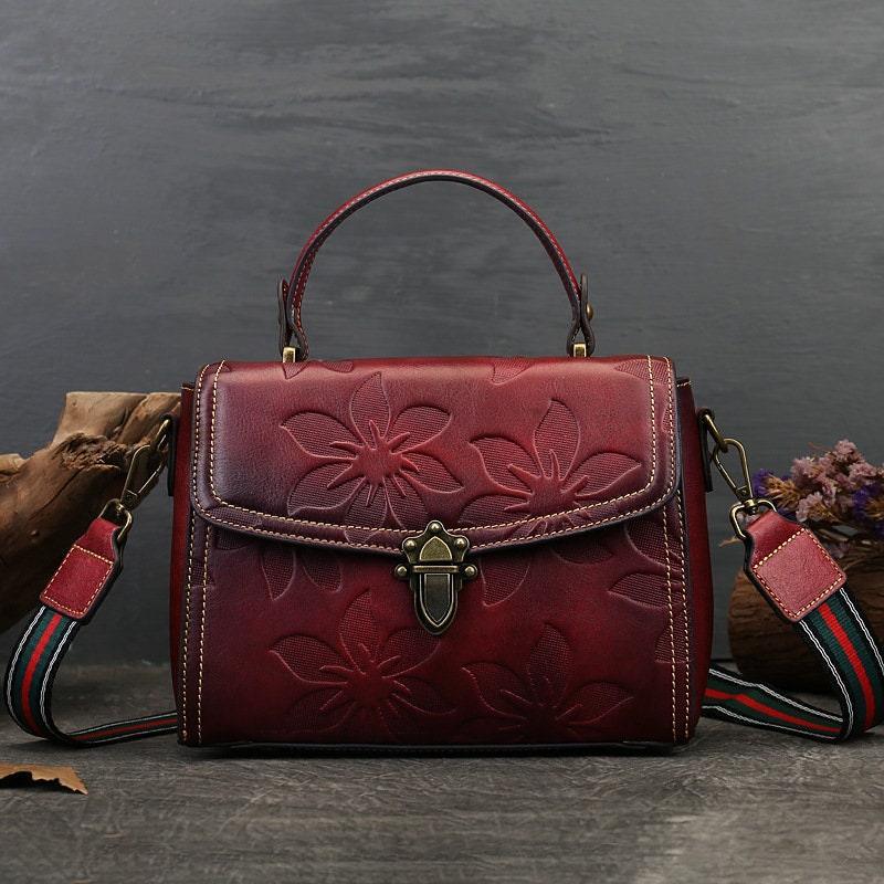 Handcrafted red full grain leather handbag with floral embossing, retro boho chic style, top handle and detachable strap