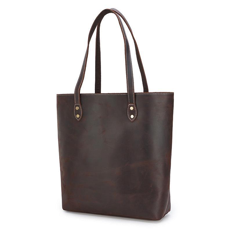 Handcrafted large brown leather tote bag with double handles and contrast stitching