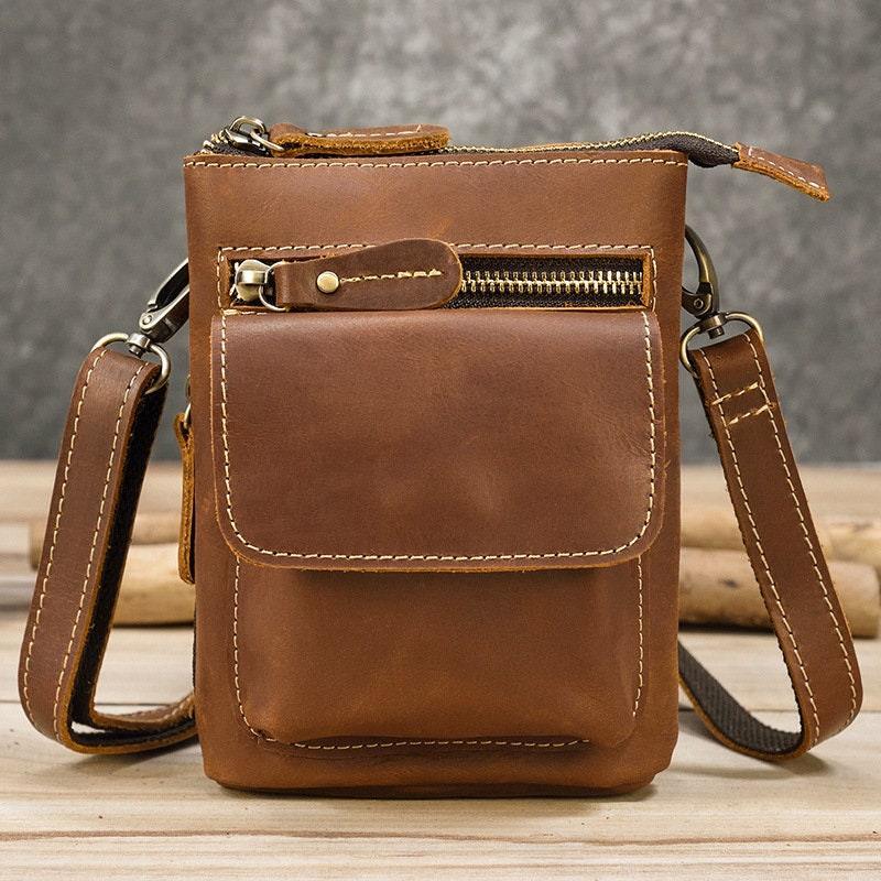 Handcrafted brown full grain leather crossbody bag with front zipper pocket and adjustable strap