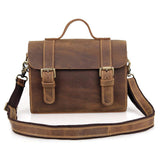 Handcrafted vintage brown leather shoulder bag with buckles and adjustable strap