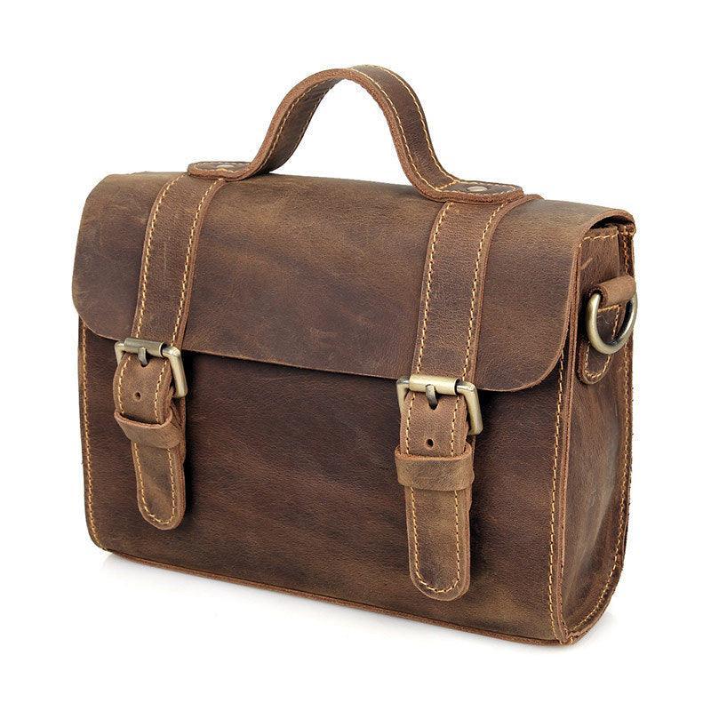 Handcrafted brown leather shoulder bag with vintage style, two front buckles, top handle