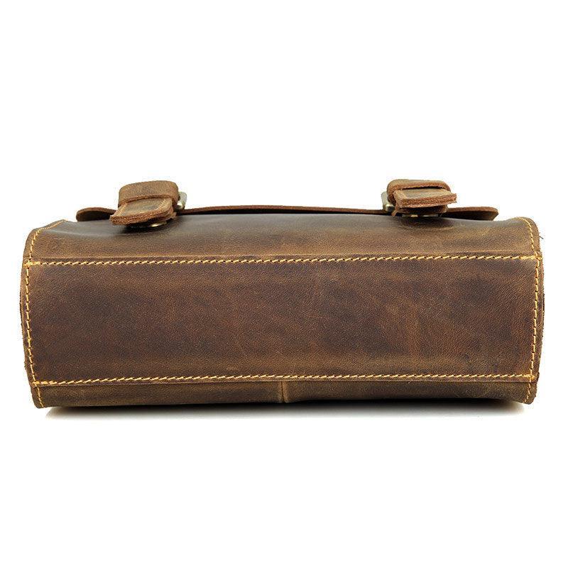 Bottom view of a handcrafted vintage style brown leather shoulder messenger bag