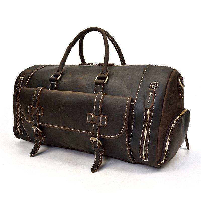 Dark brown full grain leather duffle bag with handles, front pocket, and zippered compartments