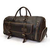 Dark brown full grain leather duffle bag with handles, front pocket, and zippered compartments