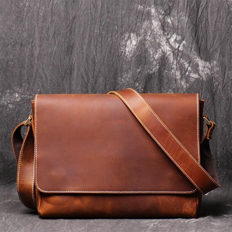 Handmade retro cowhide leather shoulder bag with adjustable strap and flap closure