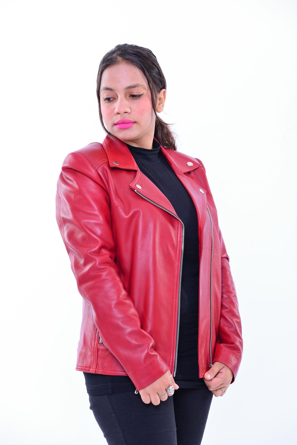 Woman wearing slim fit red genuine leather biker jacket with zip details