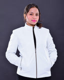 Woman wearing a slim fit white genuine leather biker jacket with front zipper pockets
